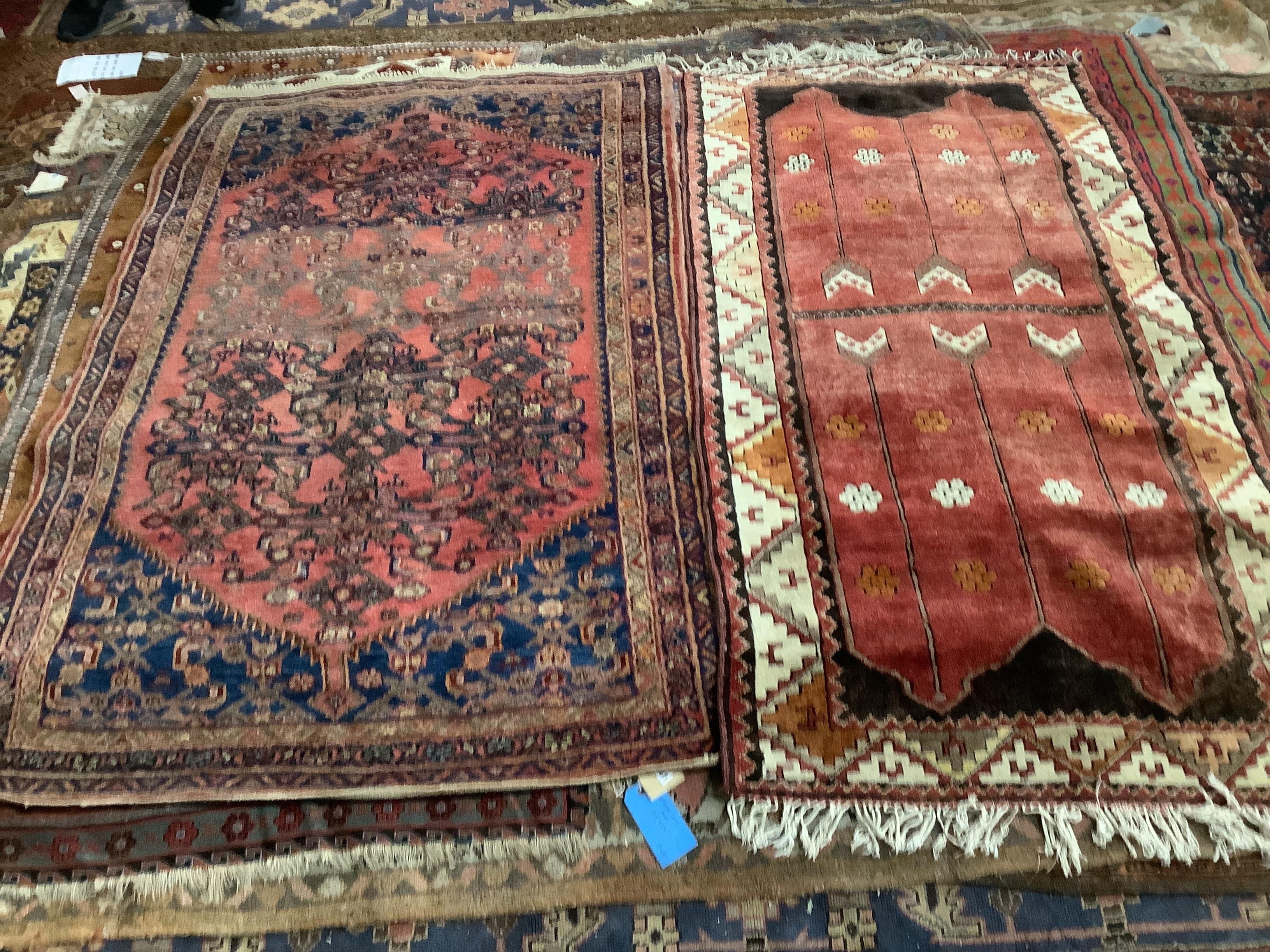 A Caucasian red ground rug, 197 x 120cm and a modern Caucasian style rug, 185 x 99cm